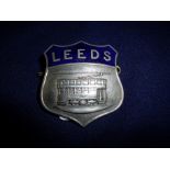 White metal and enamel Leeds Tramways shield shaped cap badge by Firmin London