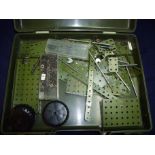 Cased of Meccano green parts and accessories