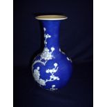 Japanese blue & white vase decorated with blossom trees with signature panel to the base (23.