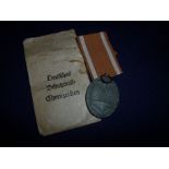 WWII German medal with ribbon in original paper packet of issue