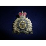 Royal Canadian Mounted Police gilt metal cap badge