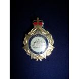 Gilt metal Australian Protective Services badge