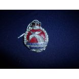 Royal Papaua & New Guinea Constabulary white metal and enamel cap badge,