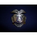 American City of Santa Ana California Police gilt metal and enamel cap badge,