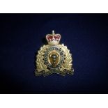 Royal Canadian Mounted Police gilt metal cap badge