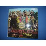 Copy of 'The Beatles Sergeant Pepper Lonely Hearts Club Band' signed in the gate fold by Peter