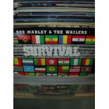 Box containing approximately 53 various LPs and 12" single including 'Survival by Bob Marley and