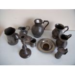 Selection of pewter ware including jugs, small plates, candlesticks,