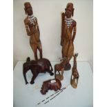 Selection of African carved hard wood and other figures including elephants, giraffes,