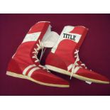 Pair of red title boxing boots singled by various boxers including Bill Chambers, Davey Holland,