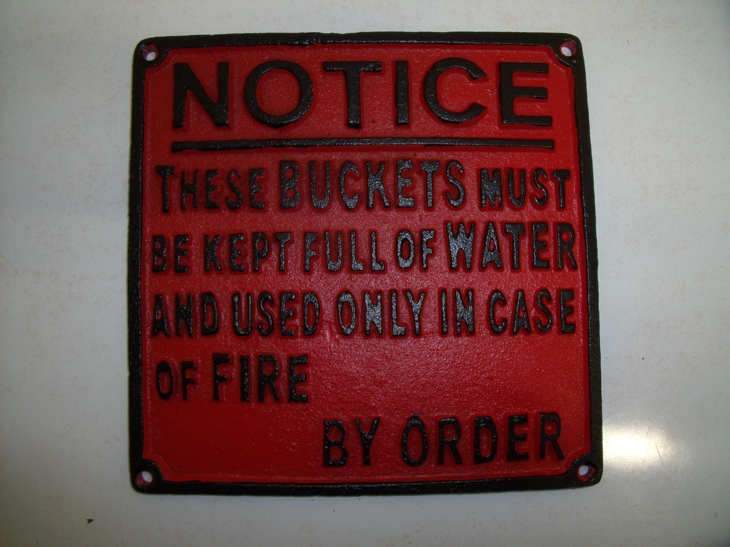 Reproduction cast metal notice 'Notice these buckets must be kept full of water and used only encase