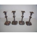 Set of four silver plated candlesticks with embossed design and detachable sconces (22cm high)