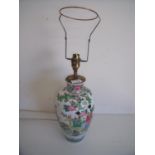 Chinese ceramic vase converted to a table lamp depicting various female figures within floral