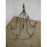 Six branch wrought metal centre hanging candle mounted chandelier (height 83cm)