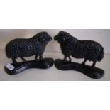 Pair of cast metal door stops in the form of rams (16cm high)