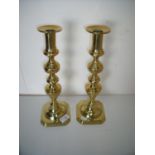 Large pair of brass candlesticks on turned columns and square push bases (35cm high)