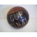 Reproduction stitched leather football with painted detail of a cup final