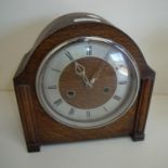 Oak cased 1930s mantel clock with striking movement