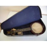 Cased Keech 4 string banjo stamped PAT.219720/23