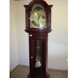 Modern mahogany cased brass moon dial chiming long case clock