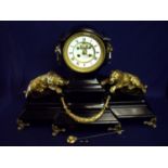 Extremely large an elaborate Victorian black slate mantel clock with raised white enamel dial with