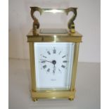 Quality modern brass cased bevelled edged glazed carriage clock marked Angelus