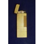 Narrow gold plated Dunhill pocket lighter with engine turned square block detail, the base stamped