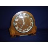 1920/1930s walnut cased inlaid striking mantle clock, the movement stamped FHS (22cm high)