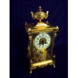 Elaborate gilt cased Maple & Co mantel clock enclosed by four bevelled and etched glass panels