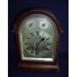 Cased Gustav Becker chiming mantel clock with steel face enclosed by bevel edged panelled door, with