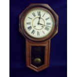 Walnut and ebonised drop dial wall clock by Ansonia Clock Co New York USA