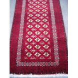 Small red ground Persian pattern rug (96cm x 202cm)