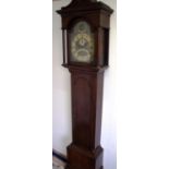 Oak cased 8 day long case clock with brass dial with secondary and date dial with inscribed name for