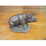 Heredite bronze effect figure of a pig