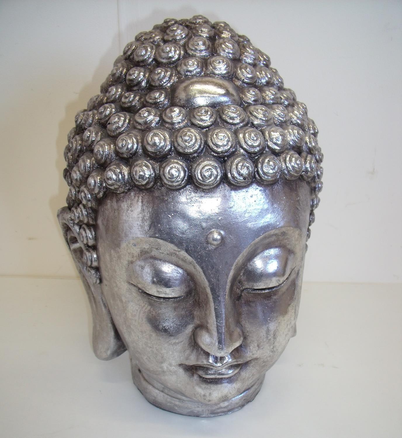 Decorative figure of a Buddha's head in silver finish (35cm high)