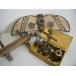 Carved Native American style wood figure, tin box, brass bell, crucifix and other items in one box