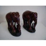 Pair of carved hardwood figures of elephants with calf (25cm high)