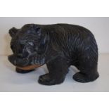 Small carved wood Black Forest style bear with salmon (11cm high)