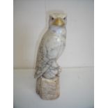 Carved marble figure of a eagle sat upon a rocky outcrop (35cm high)