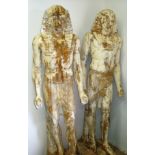 An unusual and scarce pair of 19th/20th C carved pine wood life sized Egyptian figures with minor