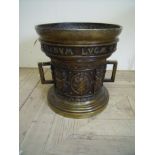 Large 16th C design bronze two handle medicine mortar cast with armorial crest, figures and swags