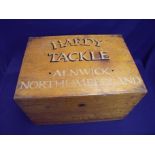 Edwardian oak fishing tackle box with hinged rectangular top and part fitted interior, the top