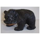 Small carved wood Black Forest style bear with salmon (11cm high)