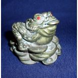 Small early to mid 20th C Chinese bronze figure of a toad with coin in its mouth seated upon a