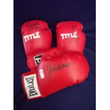 Signed Title red left handed boxing glove signed by Robeto Duran, a right handed boxing glove signed