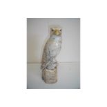 Carved marble figure of a eagle sat upon a rocky outcrop (35cm high)