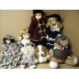 Collection of four porcelain head dolls, a flying bear etc