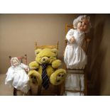 Set of three dolls chairs including two rocking chairs and a high chair, one with teddy bear,