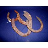 Collection of four assorted sized relic condition 19th/20th C horseshoes, believed to have been