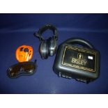 Cased Bisley electronic hearing device and a Peltor Sport Tac Predator hearing devices with